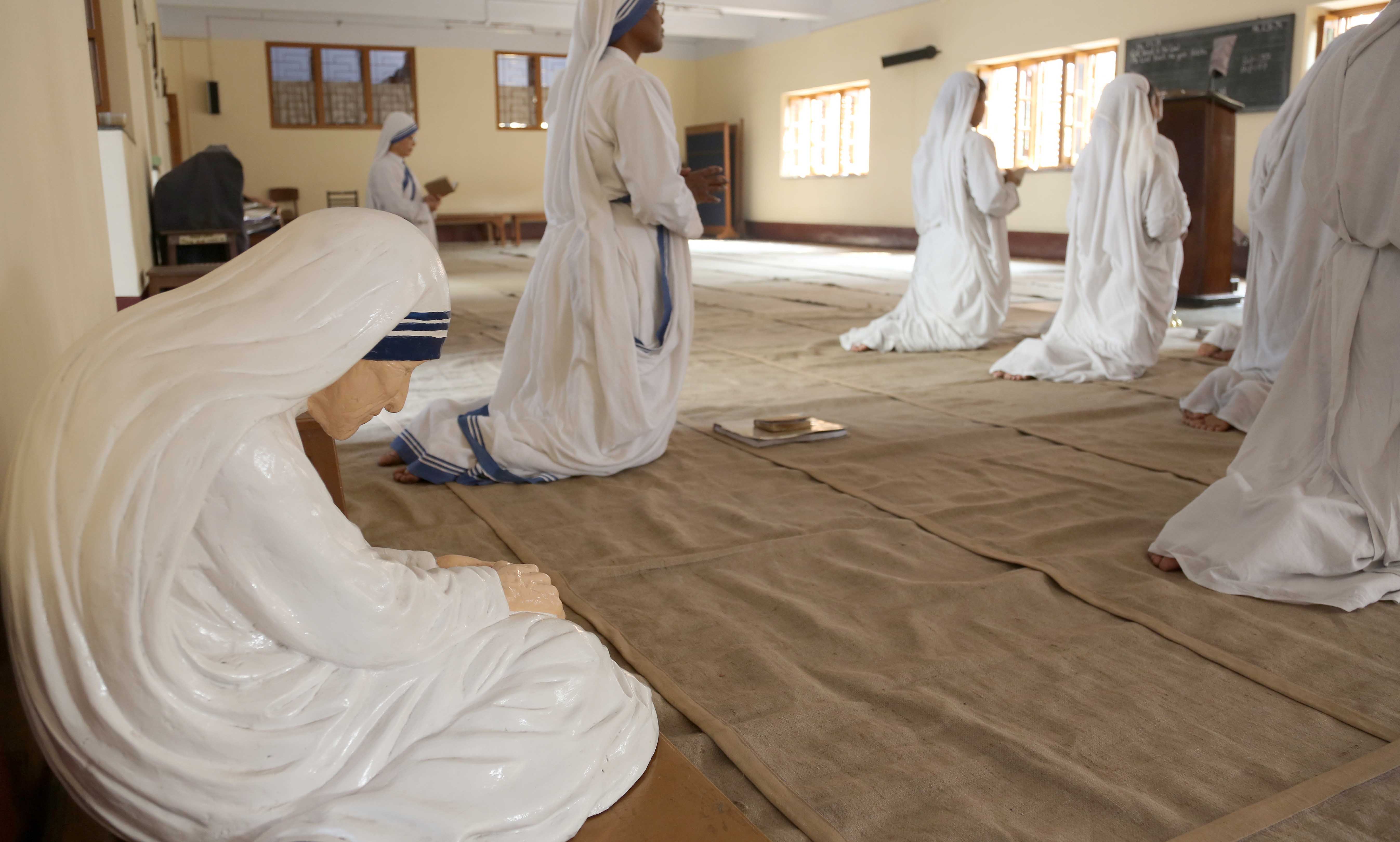 KOLKATA, INDIA - FEBRUARY 08, 2014: Statue of Mother Teresa in the chapel of the Mother House, Kolkata, India. The statue was made in the pose in which the Mother prayed.